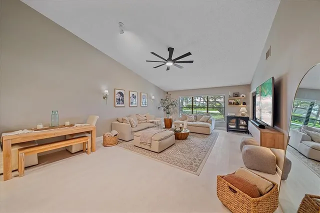 a bed room with furniture and a large window