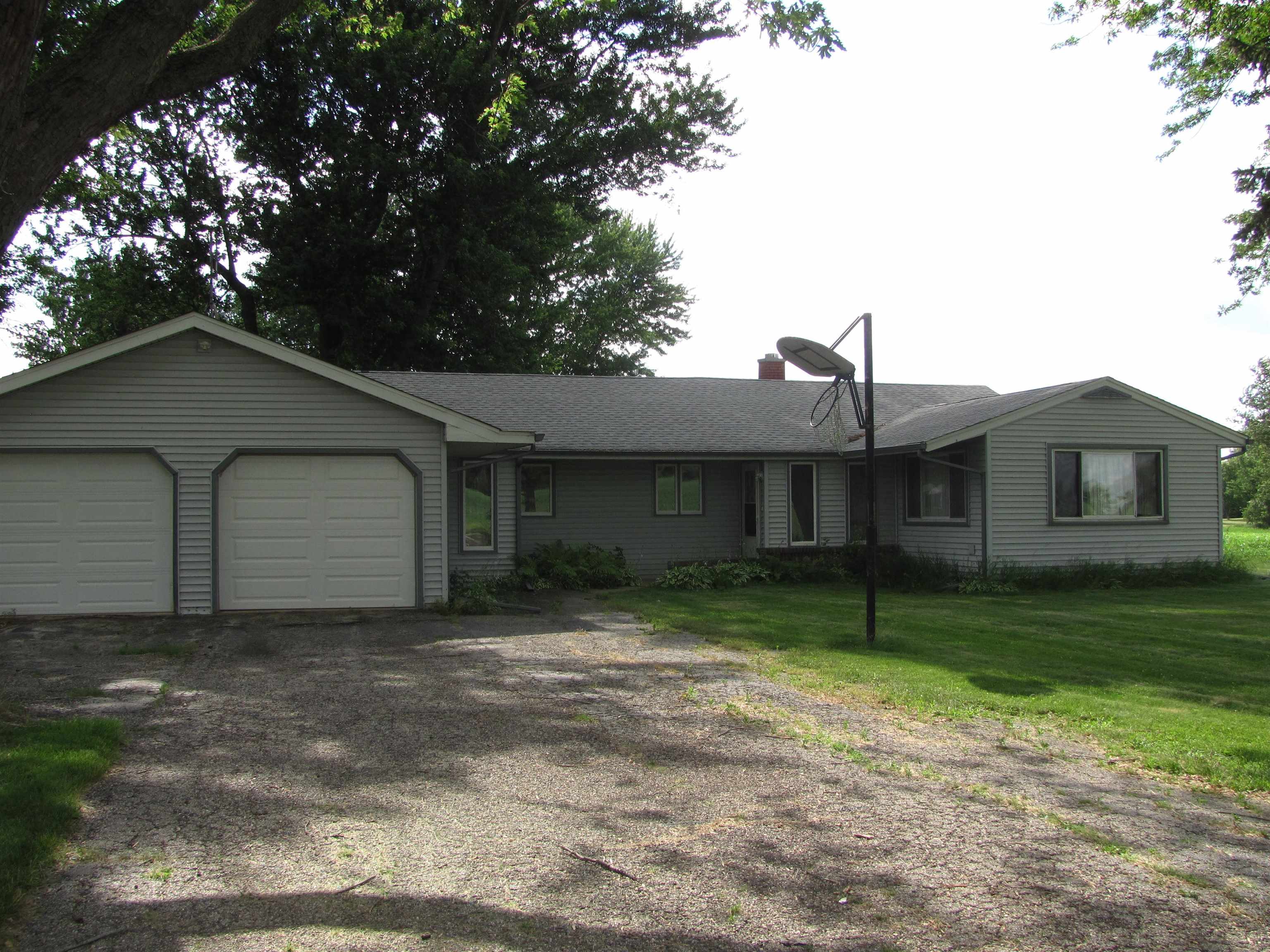 6159 Prairie Road Rockford, IL 61102 - Photo 18 of 47 a house that has a tree in front of it