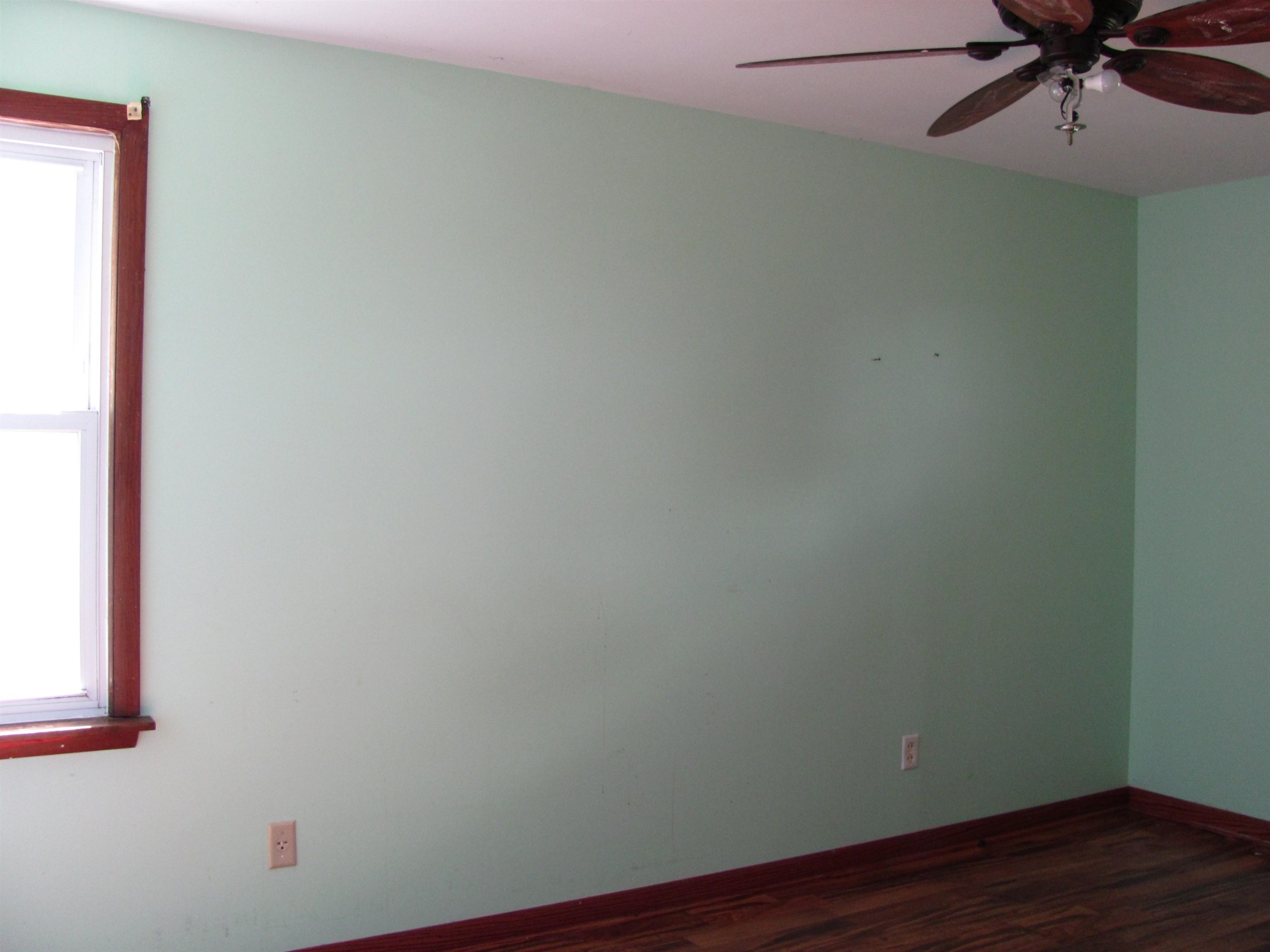 6159 Prairie Road Rockford, IL 61102 - Photo 26 of 47 an empty room with a window and a fan