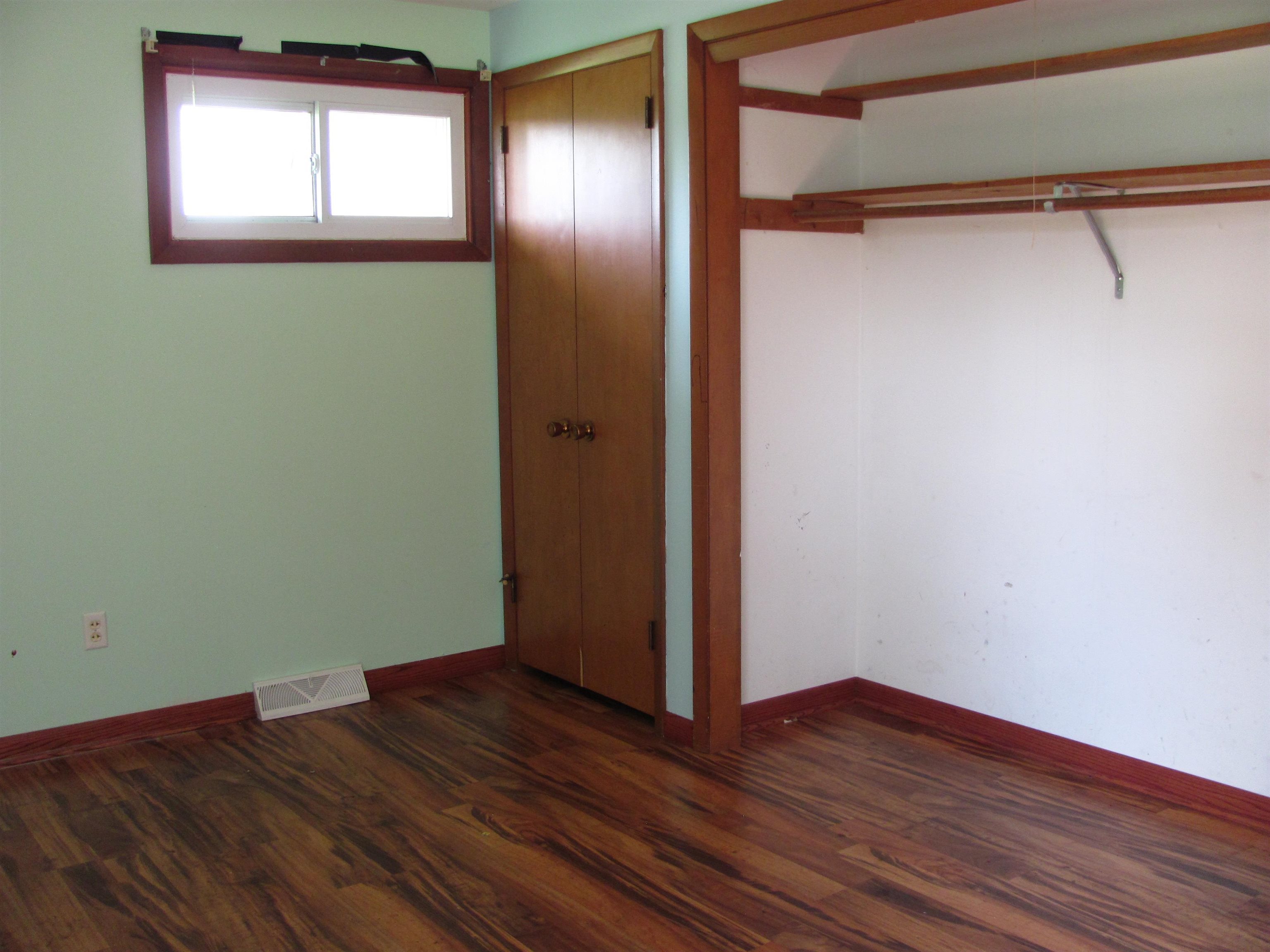 6159 Prairie Road Rockford, IL 61102 - Photo 27 of 47 a view of empty room with wooden floor and fan