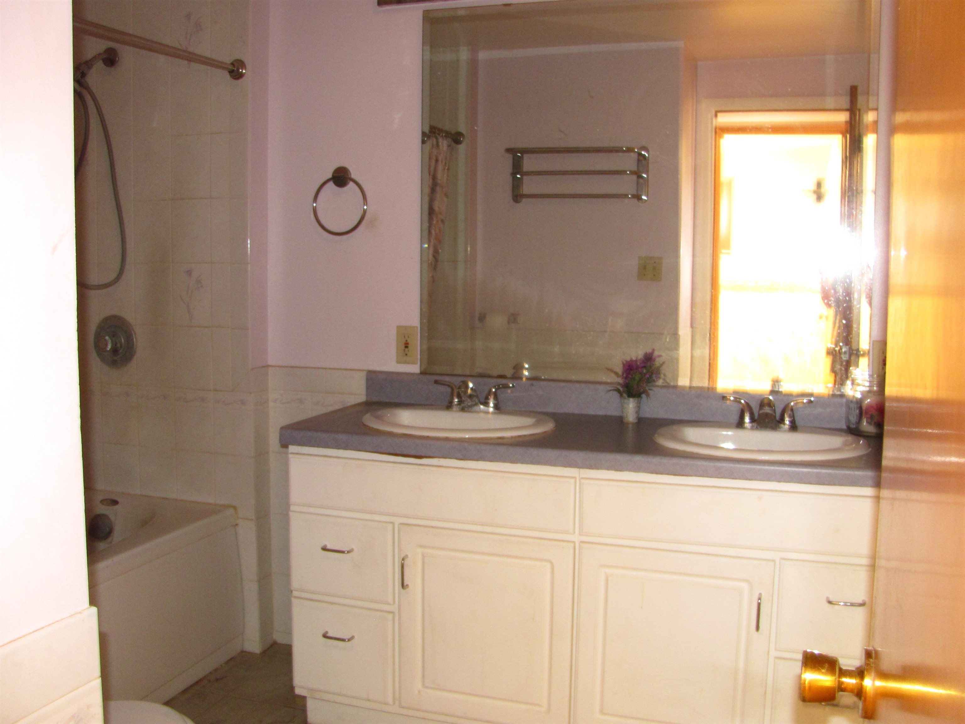 6159 Prairie Road Rockford, IL 61102 - Photo 29 of 47 a bathroom with a granite countertop sink and a mirror