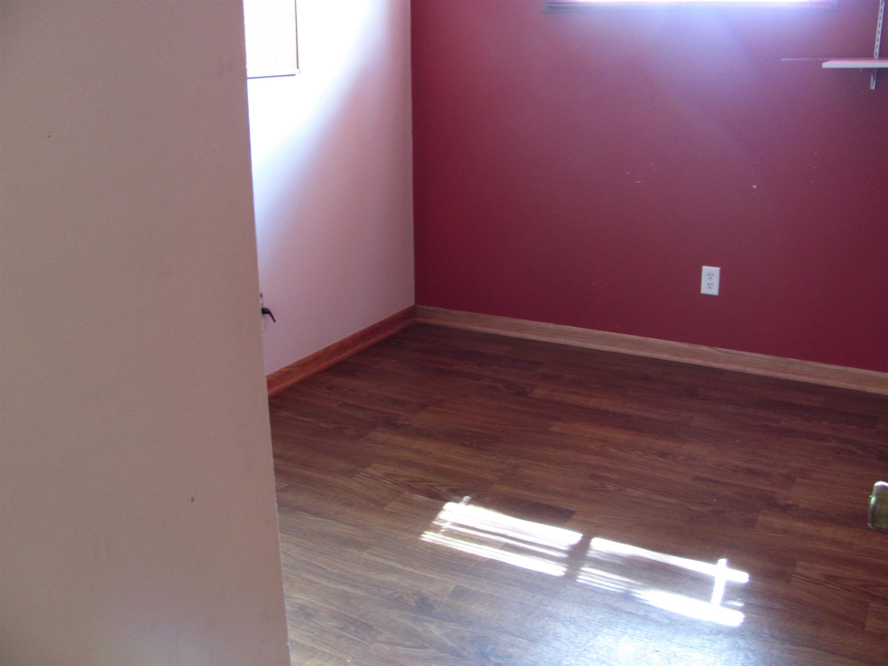 6159 Prairie Road Rockford, IL 61102 - Photo 40 of 47 a view of empty room with wooden floor and fan