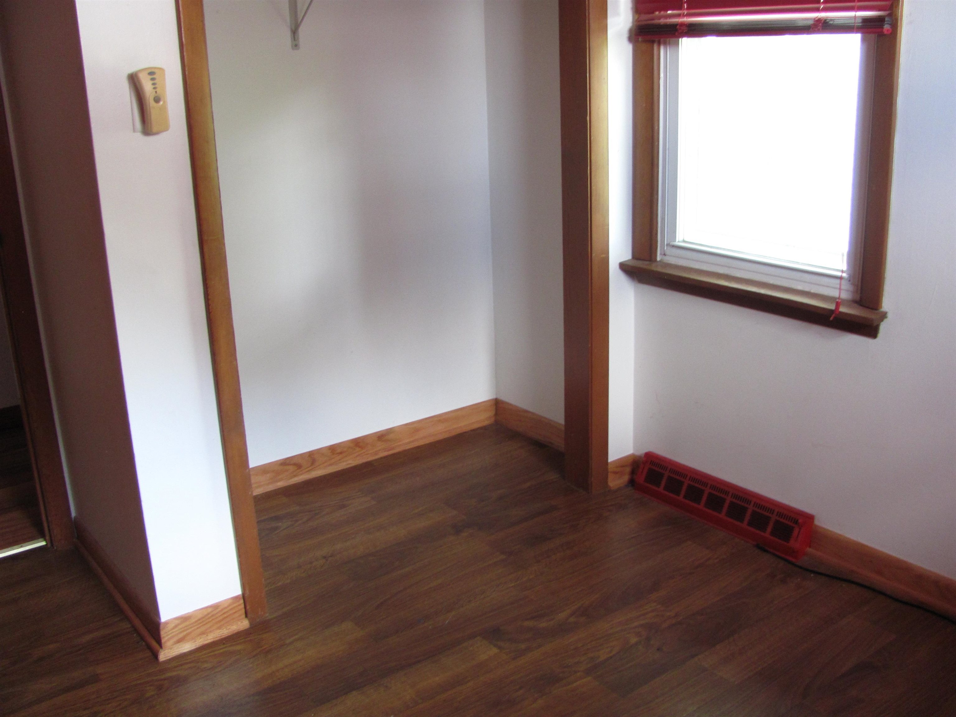 6159 Prairie Road Rockford, IL 61102 - Photo 41 of 47 an empty room with wooden floor and windows