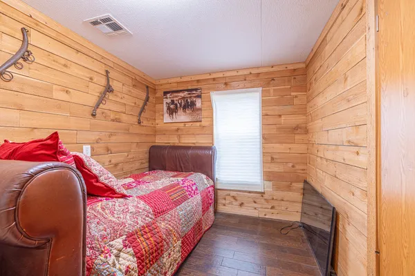 a living room with furniture wooden floor and a table
