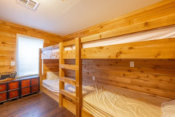 a bedroom with a bed and a table