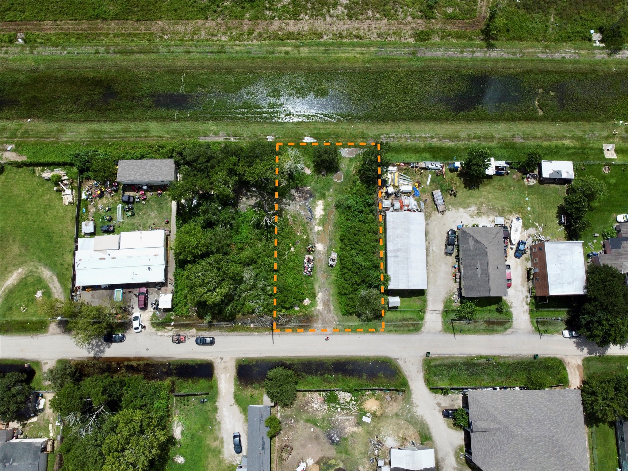 0 Judy Street Rosharon, TX 77583 - Photo 3 of 15 a view of a house with a yard and a lake