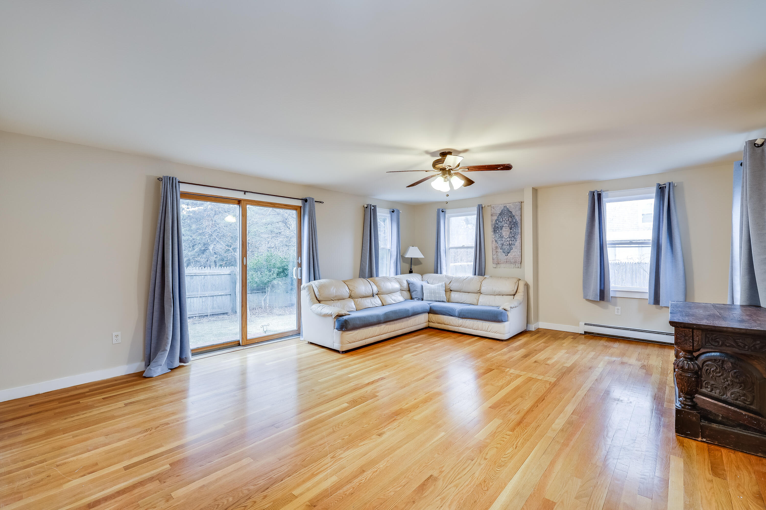 70 Shore Road Truro, MA 02666 - Photo 6 of 43 a living room with furniture and a large window