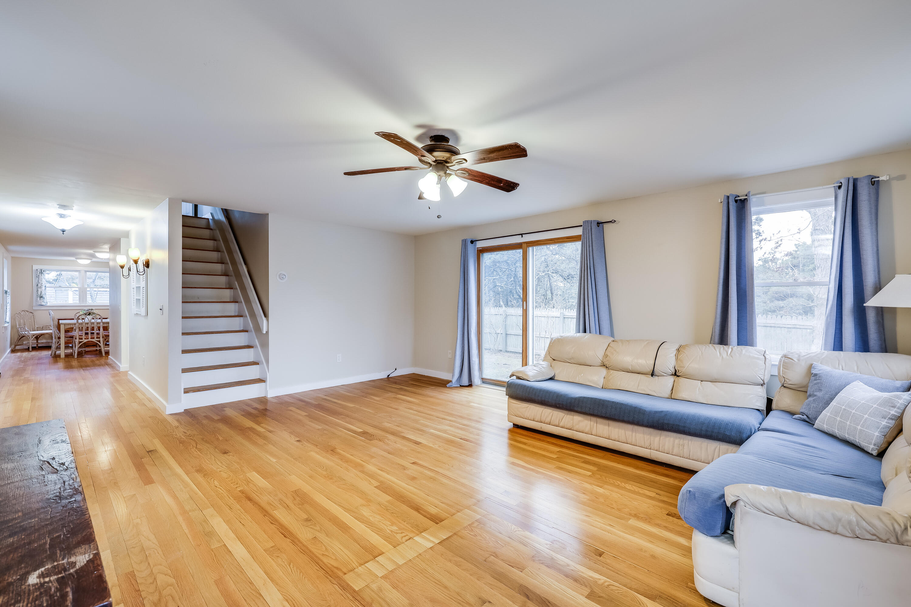 70 Shore Road Truro, MA 02666 - Photo 7 of 43 a living room with furniture and a large window
