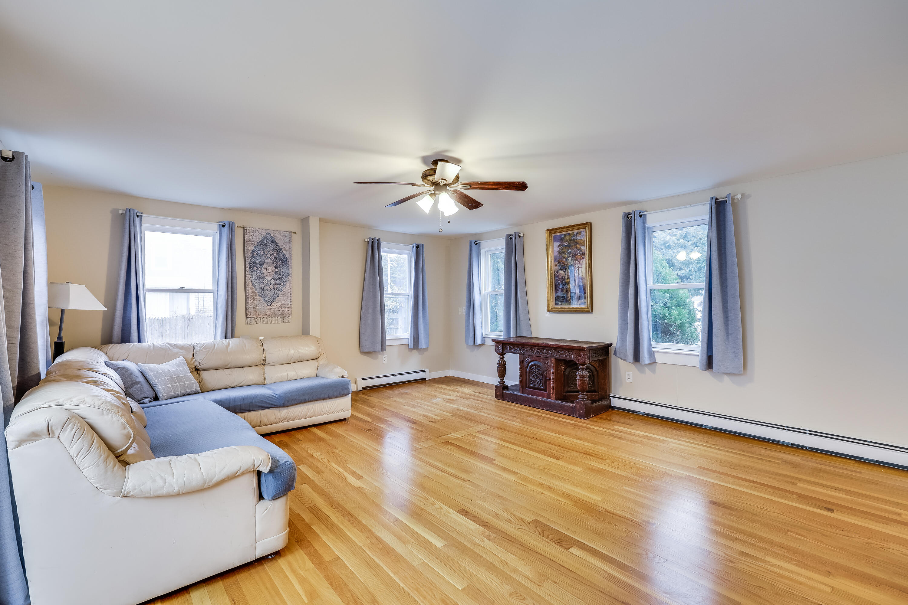 70 Shore Road Truro, MA 02666 - Photo 8 of 43 a living room with furniture and a fireplace