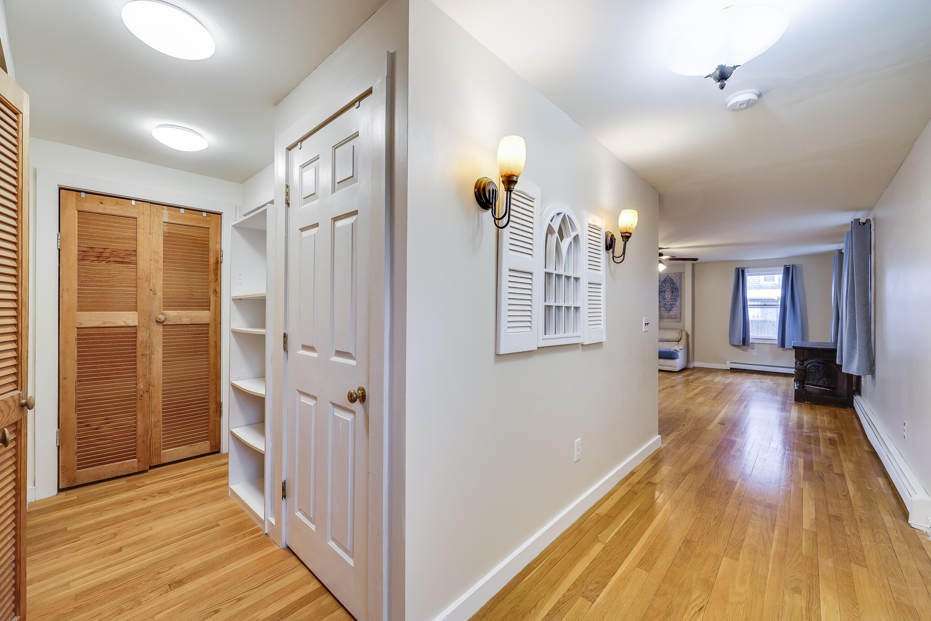 70 Shore Road Truro, MA 02666 - Photo 9 of 43 a view of a hallway with wooden floor and staircase