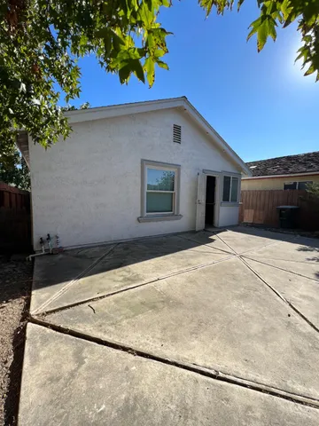 a house with trees in the background