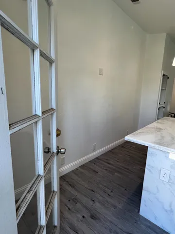 a view of a back yard from a balcony