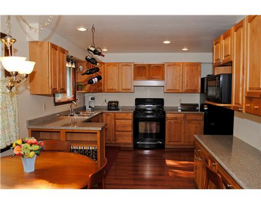 2565 Meinert Road Franklin Park, PA 15090 - Photo 2 of 18 Kitchen. Beautifully updated kitchen boasts rich maple cabinetry & a contrast of black appliances to include:Whirlpool dishwasher, GE gas stove, & microwave oven. Gourmet cooks will delight in the planning desk and abundance of countertop space.