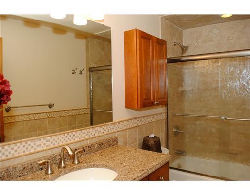 2565 Meinert Road Franklin Park, PA 15090 - Photo 5 of 18 Full Bath. This recently remodeled full bathroom boasts cherry cabinetry, Kohler sink, quartz countertop, neutral ceramic tile floors, shower/tub combo and a spacious medicine cabinet above white commode.
