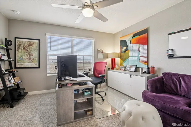 a workspace with furniture and window