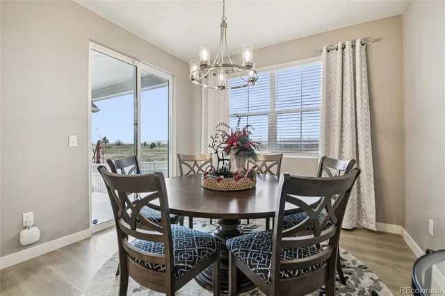 a view of a dining room with furniture window and chandelier