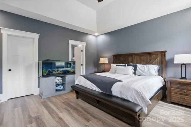 a bedroom with a bed and a couch