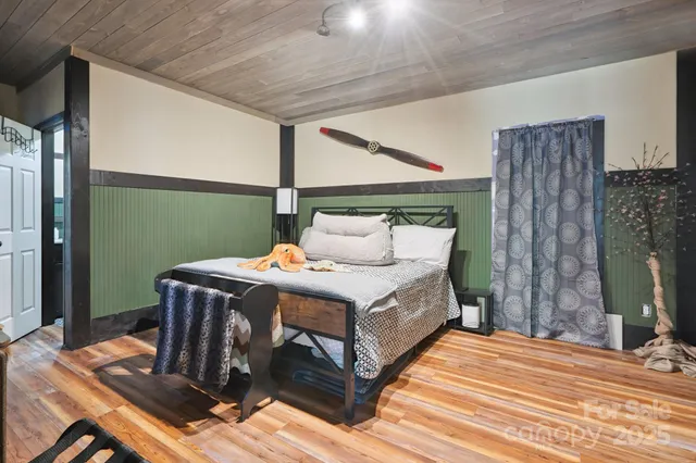 a bathroom with a sink a toilet a mirror and shower