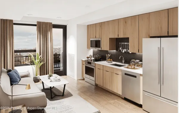 a kitchen with stainless steel appliances a stove a refrigerator and a sink