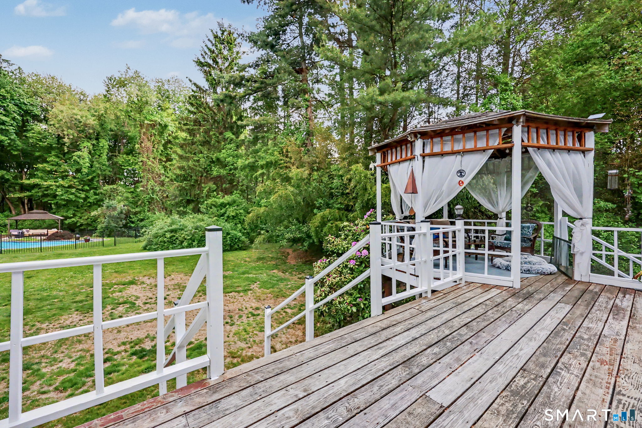 571 Wheeler Road Monroe, CT 06468 - Photo 36 of 40 a view of a wooden deck with a yard