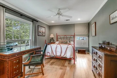 a bedroom with furniture and a window