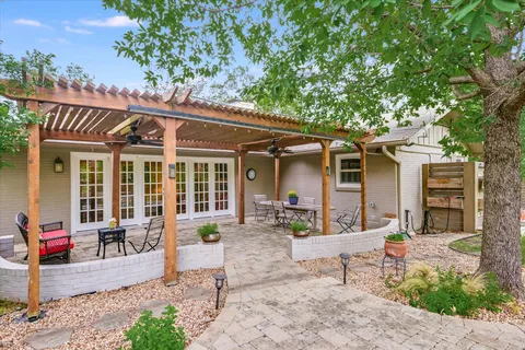 a view of a house with a sitting area and garden
