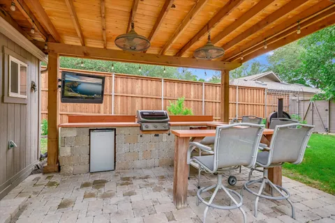 a patio with table and chairs