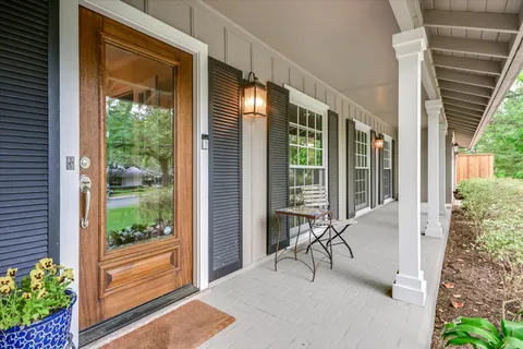 a view of balcony with furniture