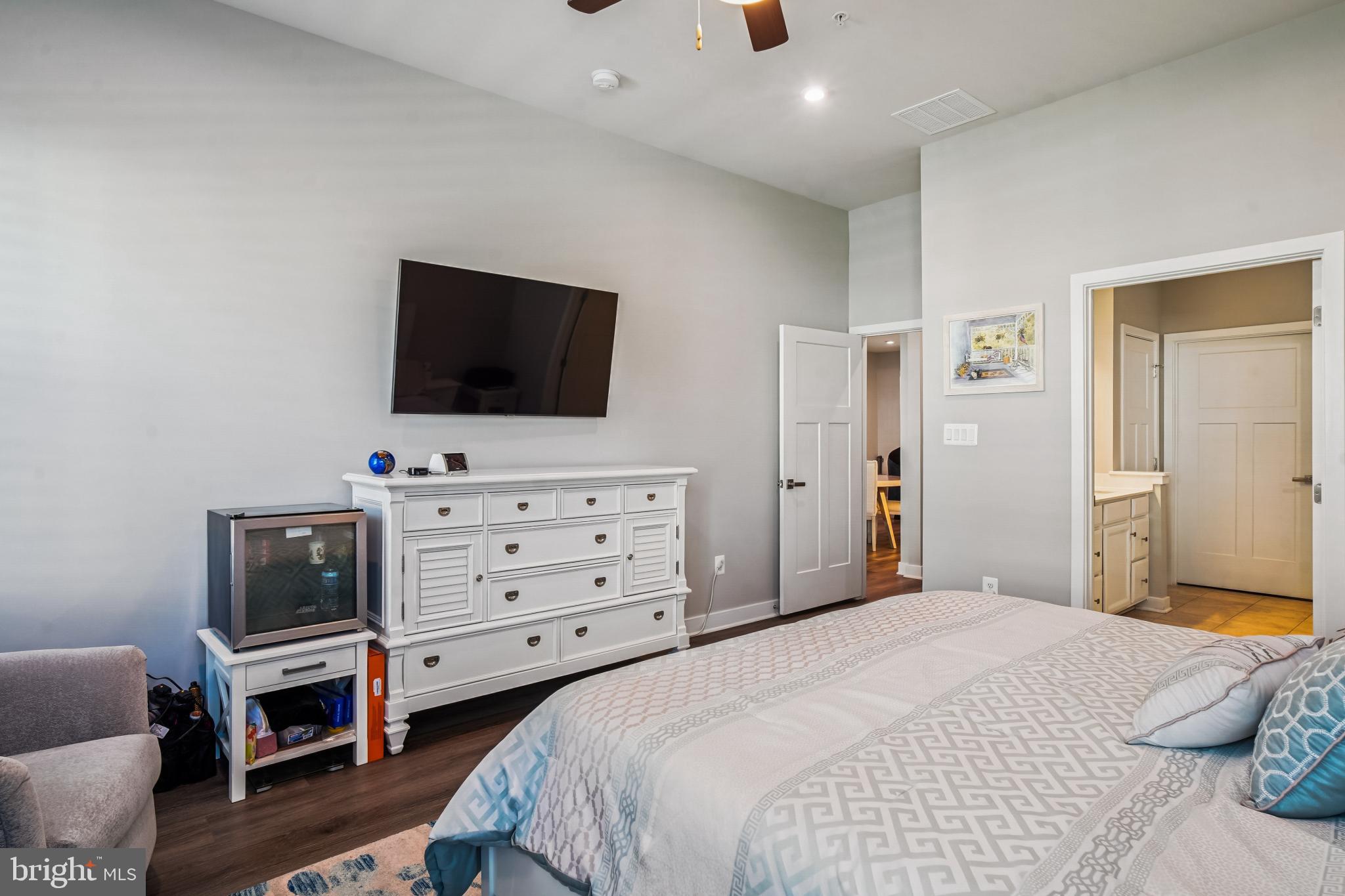 6126 Dock Street Frederick, MD 21703 - Photo 12 of 30 a bedroom with a bed and flat screen tv