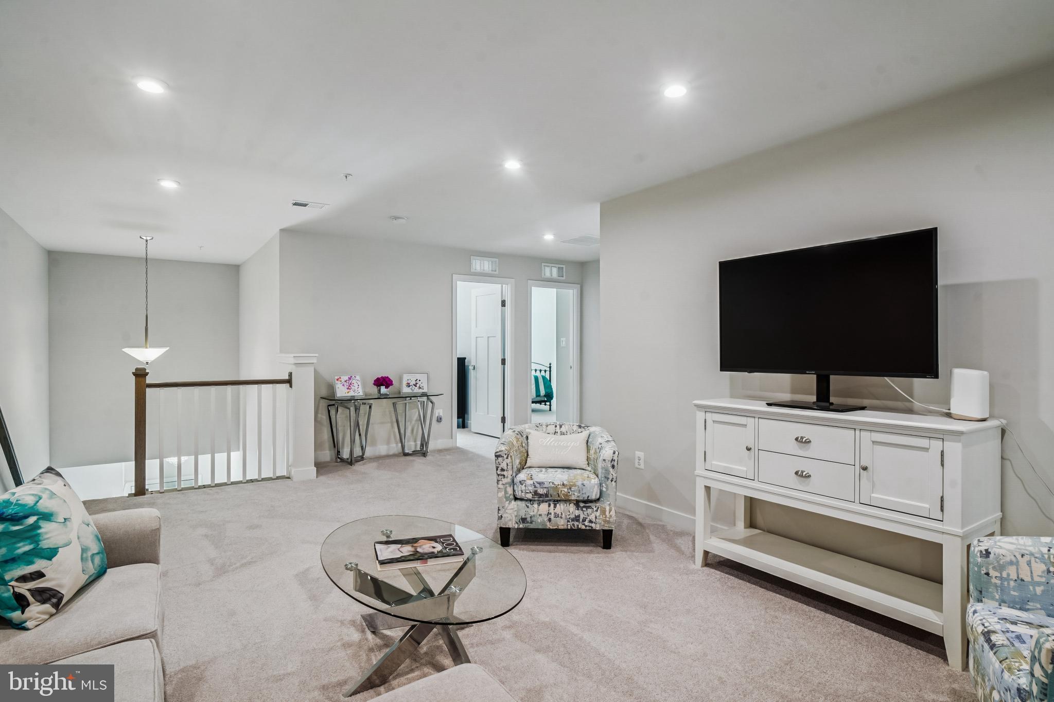 6126 Dock Street Frederick, MD 21703 - Photo 19 of 30 a living room with furniture and a flat screen tv
