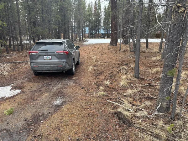 a car parked in front of a road