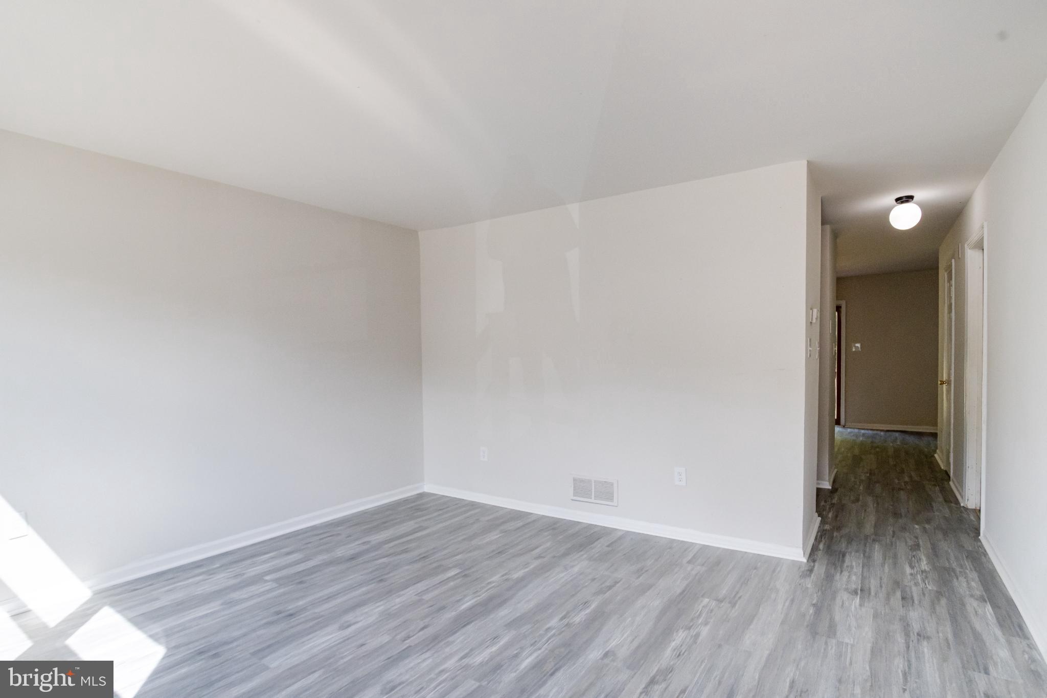 Spacious, light-filled living area awaits you.