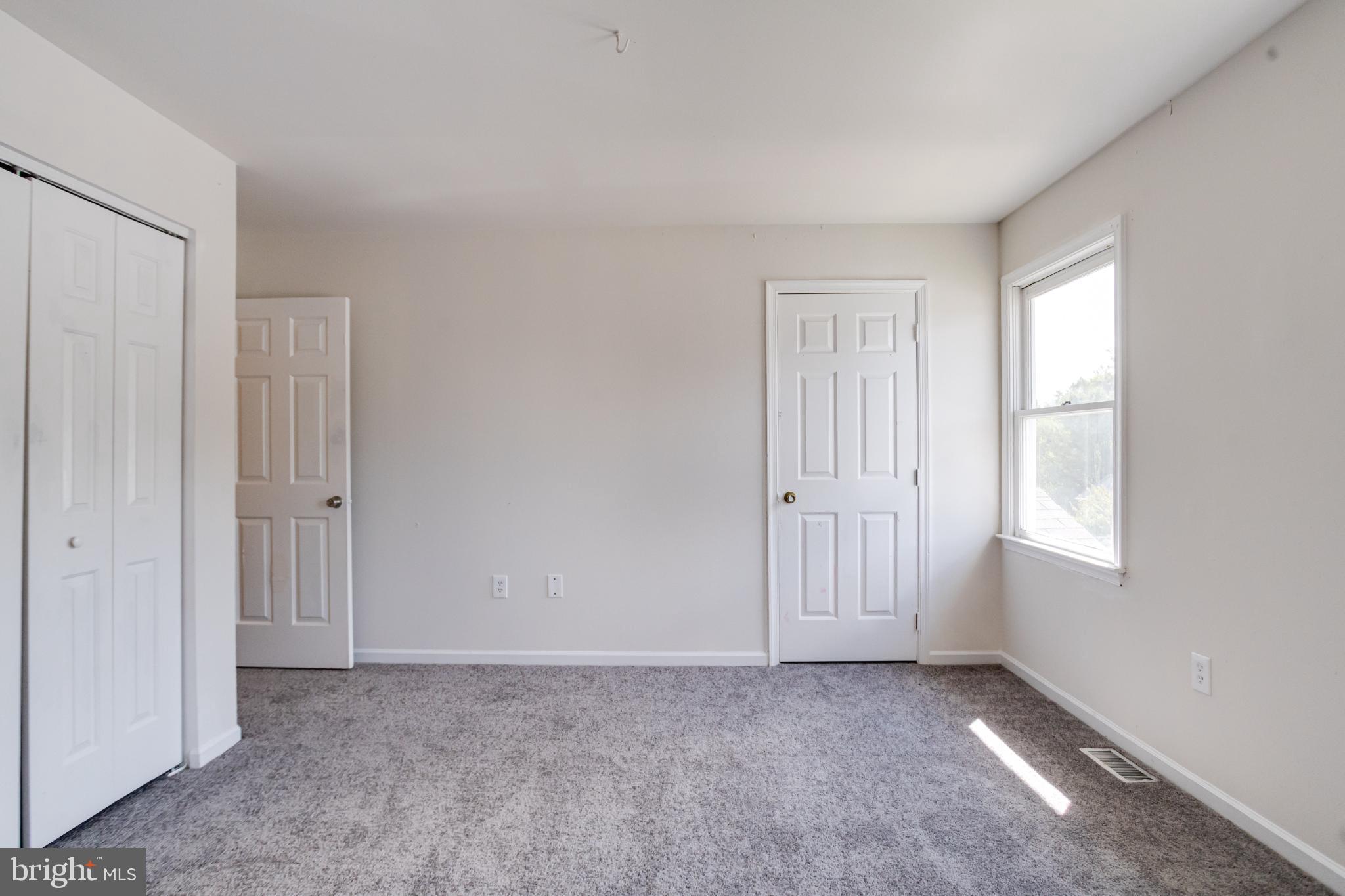 182 East Village Road Elkton, MD 21921 - Photo 22 of 42 Bright and airy room with dual closets.
