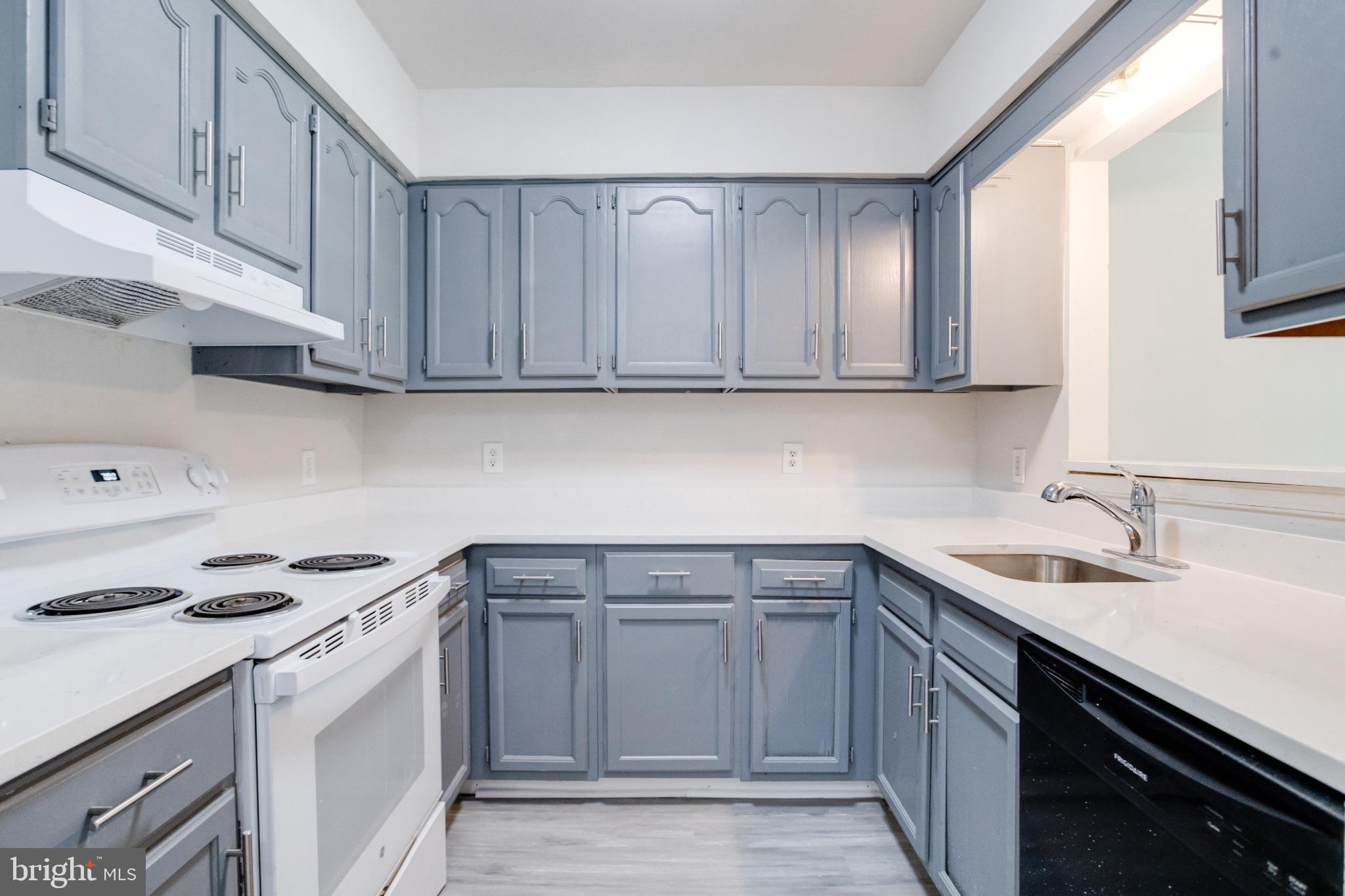Modern kitchen with sleek gray cabinetry.