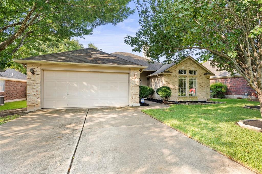 1112 Red Ranch Circle Cedar Park, TX 78613 - Photo 1 of 26 a view of a house with a yard