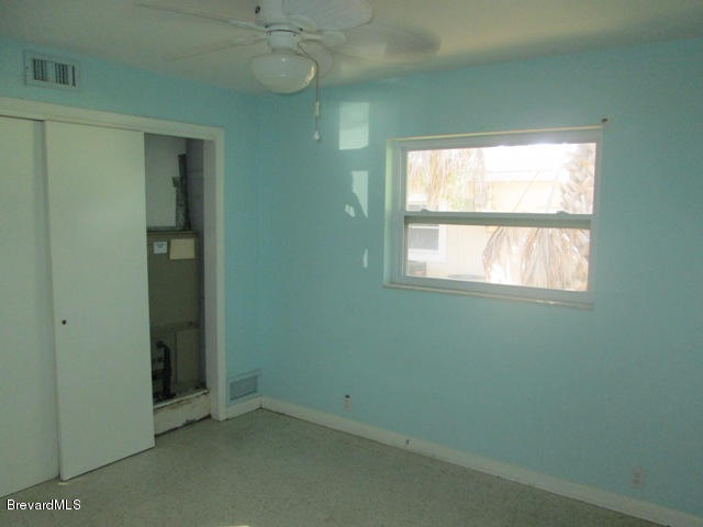 1081 Bali Road Cocoa Beach, FL 32931 - Photo 12 of 17 an empty room with a window