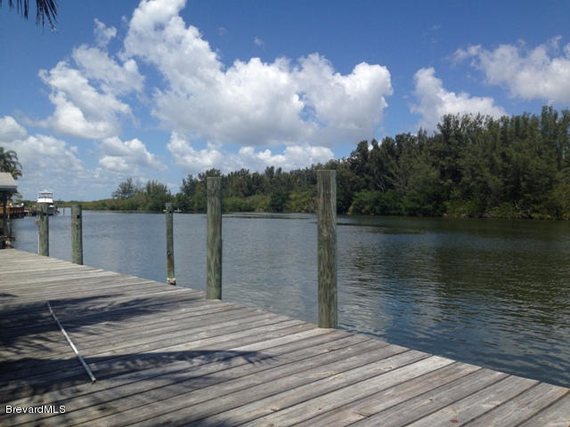 1081 Bali Road Cocoa Beach, FL 32931 - Photo 14 of 17 a terrace with wooden floor and lake view