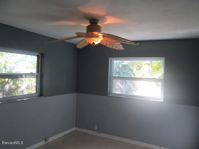 1081 Bali Road Cocoa Beach, FL 32931 - Photo 8 of 17 a view of empty room with window