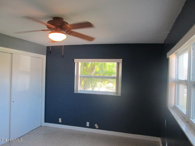 1081 Bali Road Cocoa Beach, FL 32931 - Photo 10 of 17 a view of an empty room with a window