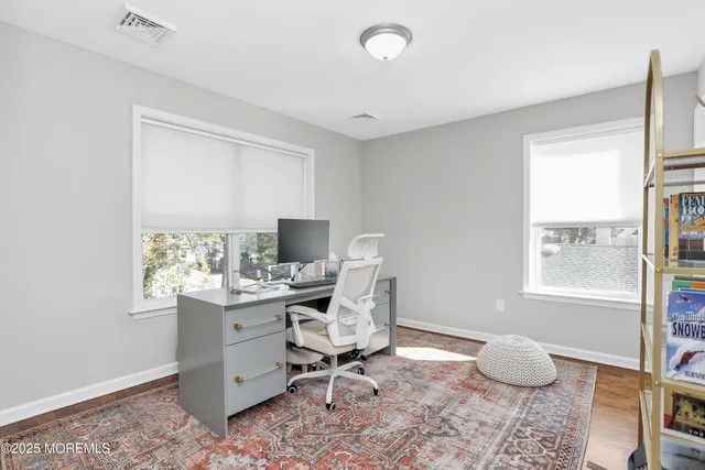 a workspace with furniture and window