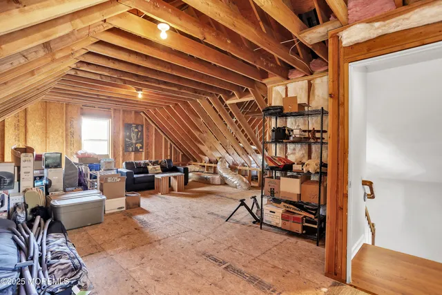 a view of entryway with workspace and stairs