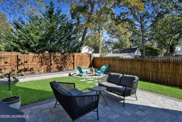 a backyard of a house with outdoor seating