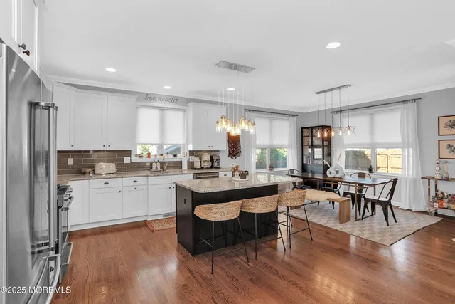 a kitchen with lots of counter top space and dining table