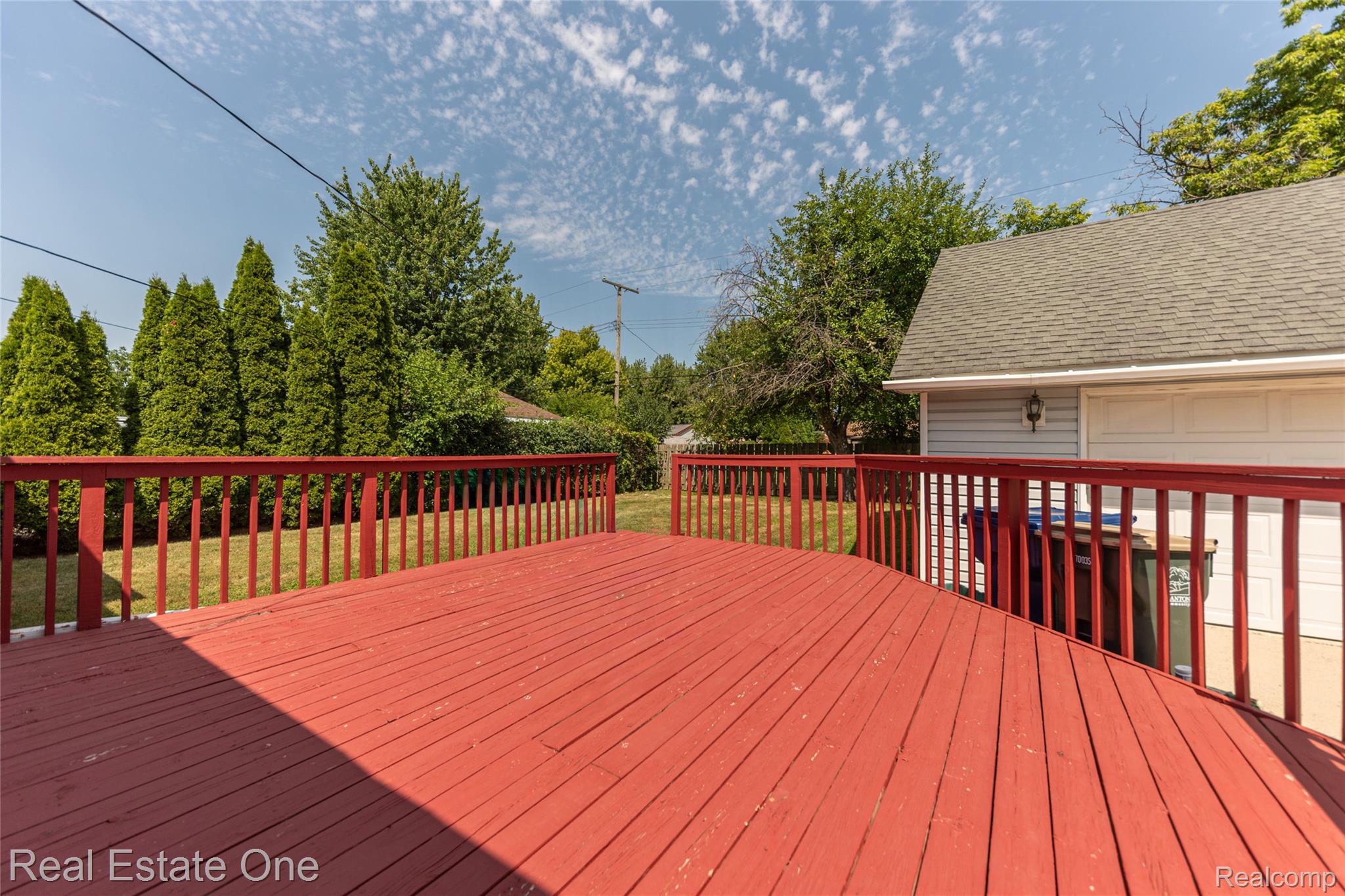 1380 North Sheldon Road Canton, MI 48187 - Photo 7 of 29 Expansive red-stained deck with a railing system