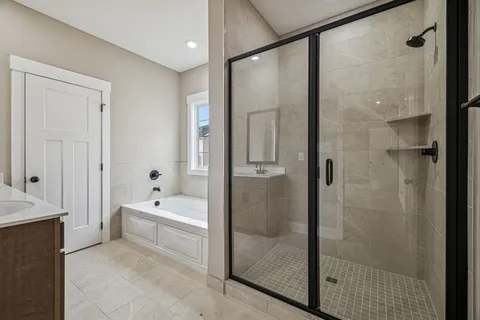a bathroom with a bathtub and a shower