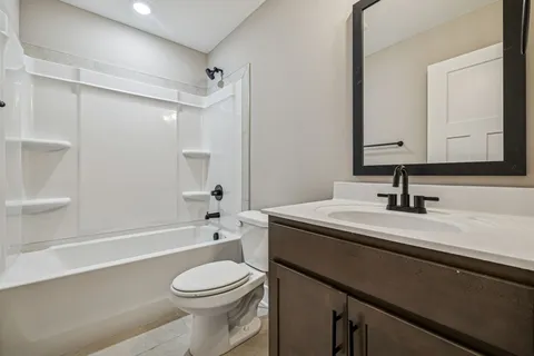 a bathroom with a sink a toilet and a bathtub