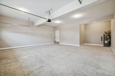 en empty room with ceiling fan and windows