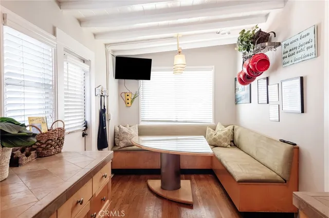 a living room with furniture and flat screen tv