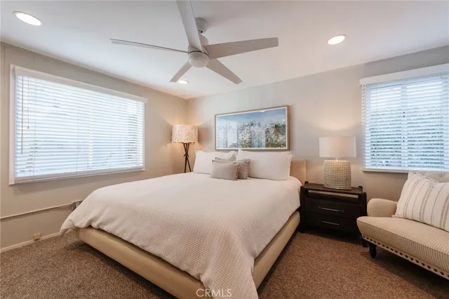 a bedroom with a bed and a couch