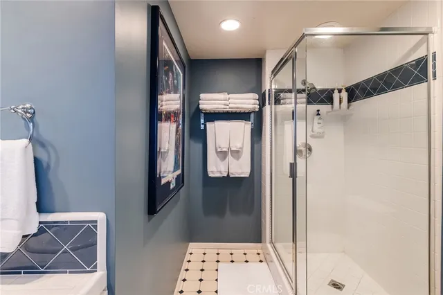 a bathroom with a mirror and a shower